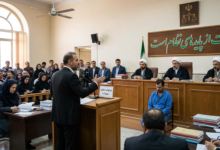 Lawyer addressing judges in an Iranian courtroom beneath Persian justice motto